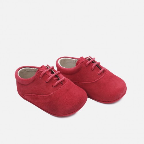 New born red derby shoe